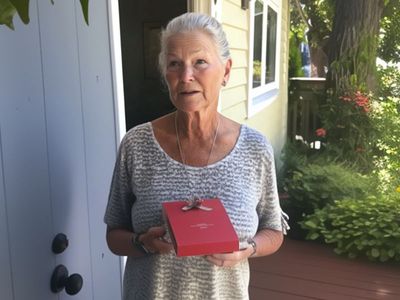 My High School Girlfriend Showed Up at My House 48 Years After Our Last Meeting,
Holding an Old Red Box